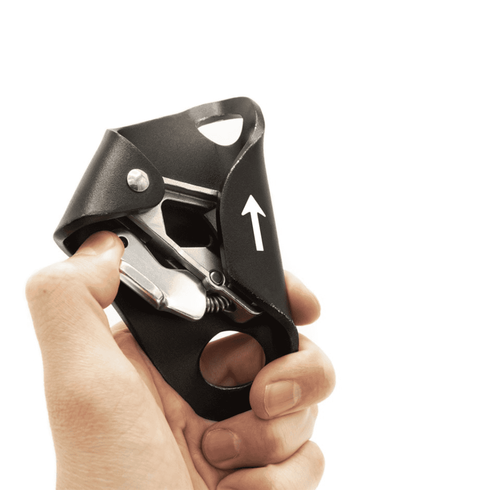 ISC Chest Ascender black metal outer sheath with silver clip and hand showing opening mechanism
