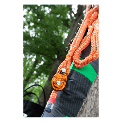 Notch 1/2" Rigging Block in bright orange colour on rope in tree setting