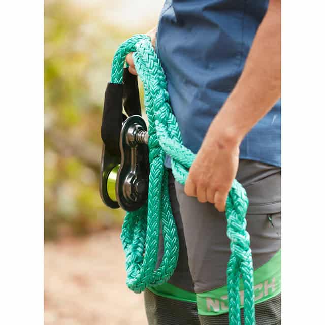 Tree climber holding Notch 3/4 Rigging Spring Block