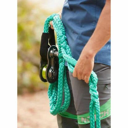 Tree climber holding Notch 3/4 Rigging Spring Block